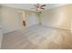 Spacious carpeted bedroom with ceiling fan offers a serene retreat with ample natural light at 10331 Northern Hills Ave, Las Vegas, NV 89166