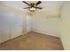 Carpeted bedroom with a ceiling fan, closet and neutral wall color offers a cozy and inviting space at 10331 Northern Hills Ave, Las Vegas, NV 89166