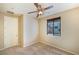 Bedroom featuring neutral carpeting, a window with blinds, and a ceiling fan at 10331 Northern Hills Ave, Las Vegas, NV 89166