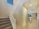 Hallway with staircase, leading to a living area with view of kitchen island at 10331 Northern Hills Ave, Las Vegas, NV 89166