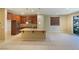 Spacious kitchen features an island with granite countertops and stainless steel appliances at 10331 Northern Hills Ave, Las Vegas, NV 89166