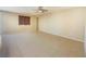 Bright living room features tile flooring, neutral paint, and a ceiling fan at 10331 Northern Hills Ave, Las Vegas, NV 89166