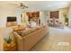 Open-concept living and dining area with neutral décor and tile floors, perfect for entertaining at 10331 Northern Hills Ave, Las Vegas, NV 89166