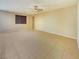 Bright living room features tile flooring, neutral paint, and a ceiling fan at 10331 Northern Hills Ave, Las Vegas, NV 89166