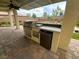 Outdoor kitchen featuring a built-in grill, counter space, and storage, ideal for outdoor cooking and entertaining at 10331 Northern Hills Ave, Las Vegas, NV 89166