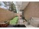 Private backyard with artificial turf, a covered patio, and a cozy seating area at 10400 Beautiful Fruit St, Las Vegas, NV 89183