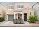 Charming two-story home with desert landscaping, covered entry and front porch, and an attached garage at 10400 Beautiful Fruit St, Las Vegas, NV 89183