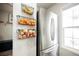 Bright kitchen featuring stainless steel refrigerator and open shelving with fruit baskets at 10400 Beautiful Fruit St, Las Vegas, NV 89183