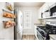 Modern kitchen with stainless steel appliances, including refrigerator and oven at 10400 Beautiful Fruit St, Las Vegas, NV 89183