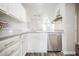 A bright kitchen with stainless appliances, white cabinets, and modern fixtures at 10400 Beautiful Fruit St, Las Vegas, NV 89183