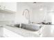 Modern kitchen with stainless steel sink and faucet, complemented by sleek countertops at 10400 Beautiful Fruit St, Las Vegas, NV 89183