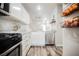 Clean kitchen with stainless steel appliances and white cabinets with modern hardware at 10400 Beautiful Fruit St, Las Vegas, NV 89183