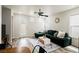 Bright living room with luxury vinyl floors, ceiling fan, stylish decor, and a back door at 10400 Beautiful Fruit St, Las Vegas, NV 89183