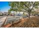 Community playground near homes, featuring swings and play equipment at 10400 Beautiful Fruit St, Las Vegas, NV 89183