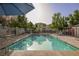Inviting community pool and deck with chairs for relaxation at 10400 Beautiful Fruit St, Las Vegas, NV 89183