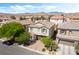 An aerial view showcasing the home's location within a well-planned community and mountain views at 10565 Olinda St, Las Vegas, NV 89179