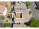Detailed overhead view of a home featuring a rooftop patio and a cozy backyard with artificial grass at 10565 Olinda St, Las Vegas, NV 89179
