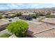 Expansive aerial view showcasing the neighborhood's many homes and community layout with mountain views at 10565 Olinda St, Las Vegas, NV 89179