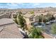 Attractive aerial view of two-story home with desert landscaping and a well-maintained front yard at 10565 Olinda St, Las Vegas, NV 89179