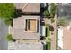 Intricate aerial view of a backyard featuring artificial turf, a shaded patio, and rooftop deck access at 10565 Olinda St, Las Vegas, NV 89179