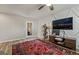 This bedroom features unique accent wall, a ceiling fan, and hardwood floors at 10565 Olinda St, Las Vegas, NV 89179