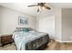 Cozy bedroom features hardwood floors, a ceiling fan, and a closet with sliding doors at 10565 Olinda St, Las Vegas, NV 89179