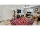 This bedroom features unique accent wall, a ceiling fan, and hardwood floors at 10565 Olinda St, Las Vegas, NV 89179