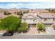A stunning home with an inviting facade, mature trees, and an attached two-car garage at 10565 Olinda St, Las Vegas, NV 89179