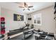 Bright gym features a ceiling fan and a window with wooden shutters at 10565 Olinda St, Las Vegas, NV 89179
