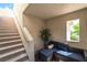 Inviting patio with stylish seating, convenient stairway access, and natural light, perfect for relaxing and entertaining at 10565 Olinda St, Las Vegas, NV 89179
