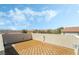 Expansive rooftop deck boasting a tiled floor, offering stunning views of the surrounding neighborhood and picturesque sky at 10565 Olinda St, Las Vegas, NV 89179