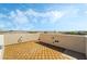 Spacious rooftop deck with textured walls and tiled flooring, ideal for outdoor relaxation and enjoying panoramic views at 10565 Olinda St, Las Vegas, NV 89179