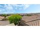 Scenic rooftop view showcasing lush trees and charming homes under a bright sky, creating a serene neighborhood backdrop at 10565 Olinda St, Las Vegas, NV 89179