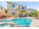 Beautiful backyard showcasing a sparkling pool, spa, and covered patio for outdoor enjoyment at 10823 Drake Ridge Ave, Las Vegas, NV 89166