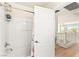 Bathroom with a shower over tub and a glimpse of the hallway and staircase at 10823 Drake Ridge Ave, Las Vegas, NV 89166