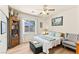 Comfortable bedroom with a view of the pool and cozy seating area at 10823 Drake Ridge Ave, Las Vegas, NV 89166