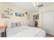 Well-lit bedroom with decor shelves and a connecting doorway leading to another room at 10823 Drake Ridge Ave, Las Vegas, NV 89166