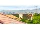 Scenic view of the city skyline with mountains in the background, seen from a residential rooftop at 10823 Drake Ridge Ave, Las Vegas, NV 89166