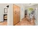 Bright dining area with large window, tile floor, and built-in storage at 10823 Drake Ridge Ave, Las Vegas, NV 89166