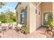 Inviting front porch with comfortable seating, decorative plants, and a welcoming entrance to the home at 10823 Drake Ridge Ave, Las Vegas, NV 89166