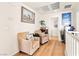 Upstairs hallway with two chairs and a view into the bathroom at 10823 Drake Ridge Ave, Las Vegas, NV 89166