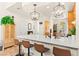 Modern kitchen island with seating, quartz countertops, stainless steel appliances, and ample storage space at 10823 Drake Ridge Ave, Las Vegas, NV 89166