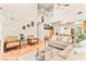 Bright living room with a staircase, comfortable seating and backyard view at 10823 Drake Ridge Ave, Las Vegas, NV 89166