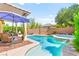 Inviting backyard featuring a private pool, spa, and covered patio, perfect for relaxation at 10823 Drake Ridge Ave, Las Vegas, NV 89166