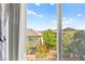 Window view of the backyard, homes, and trees at 10823 Drake Ridge Ave, Las Vegas, NV 89166