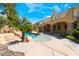 Inviting pool and patio area with rock accents, lush landscaping, and ample space for outdoor enjoyment at 11237 Campsie Fells Ct, Las Vegas, NV 89141