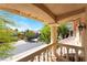 An outdoor balcony view showcasing a charming neighborhood with lush landscaping and scenic views at 11237 Campsie Fells Ct, Las Vegas, NV 89141