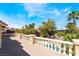Enjoy great views from the balcony overlooking lush landscaping, mature trees, and a stunning pool area at 11237 Campsie Fells Ct, Las Vegas, NV 89141