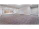 Spacious basement featuring neutral carpet and sliding glass doors at 11237 Campsie Fells Ct, Las Vegas, NV 89141