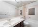 A well-lit bathroom featuring a single sink vanity, toilet, and bathtub with neutral color palette at 11237 Campsie Fells Ct, Las Vegas, NV 89141